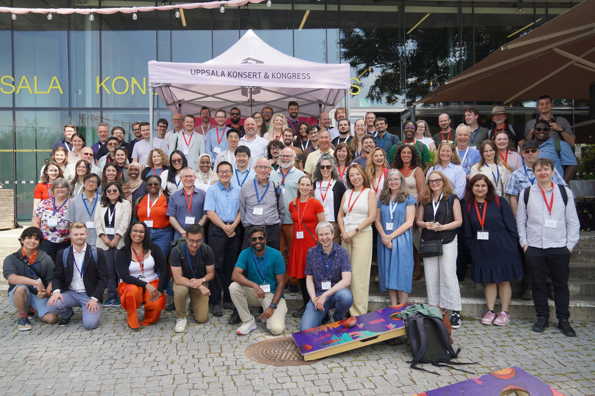 Many ICER attendees, standing in front of the UKK Conference building